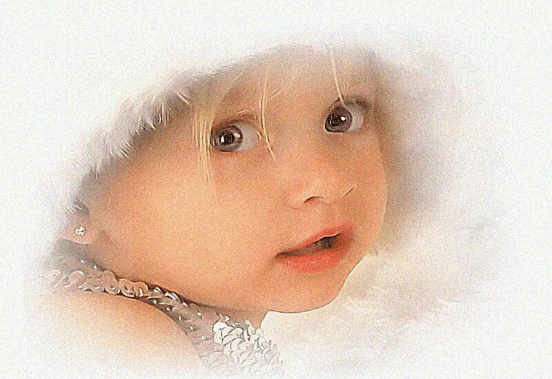child in white fur hood