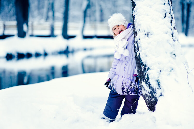 Child in Winter Coat — White, Playful