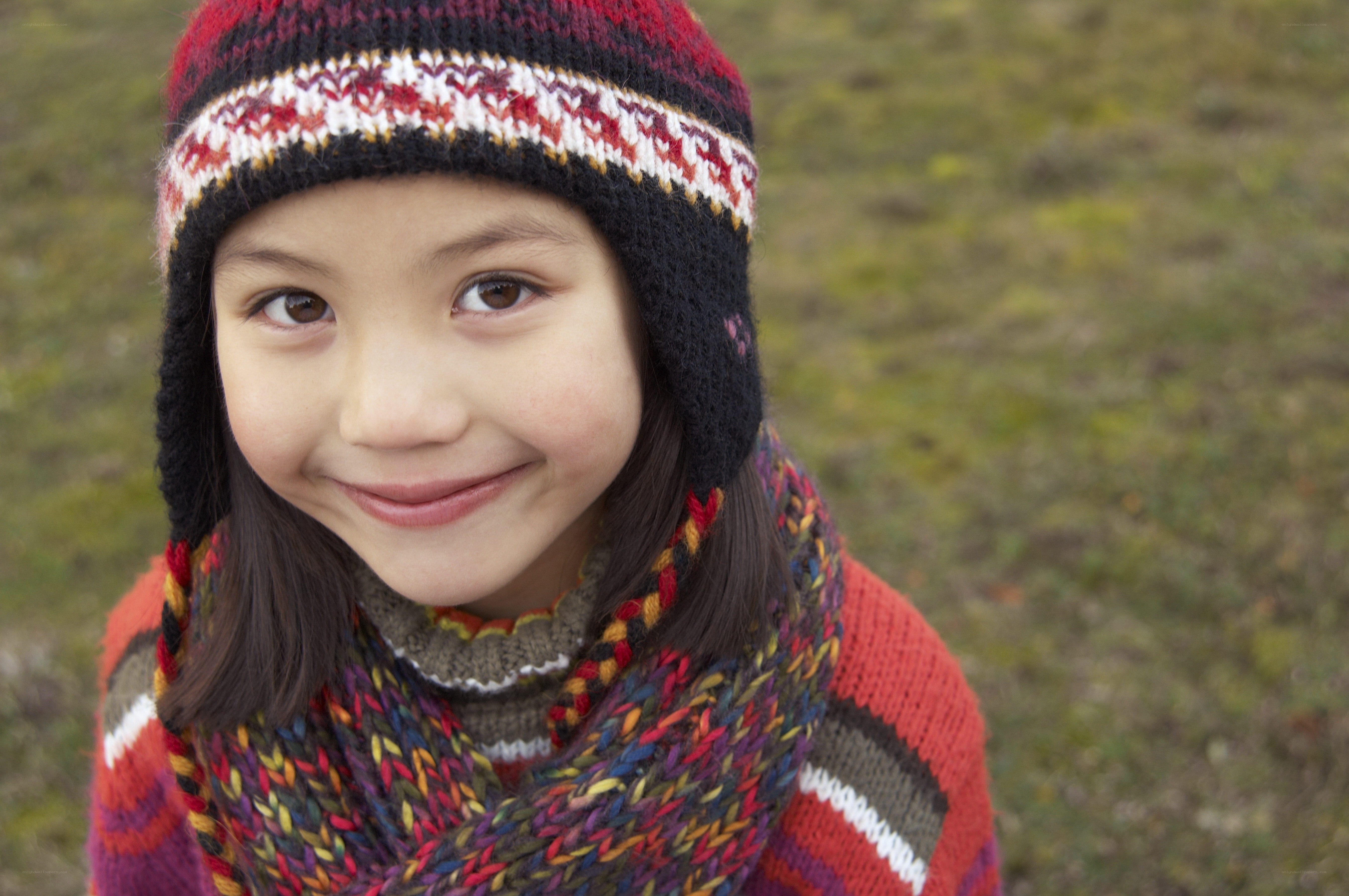 child in winter hat and scarf