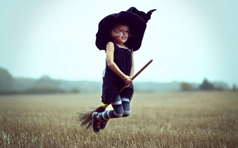 Child in Witch Costume — Black, Playful