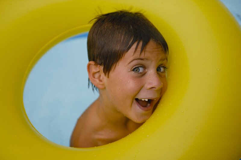 child in yellow float