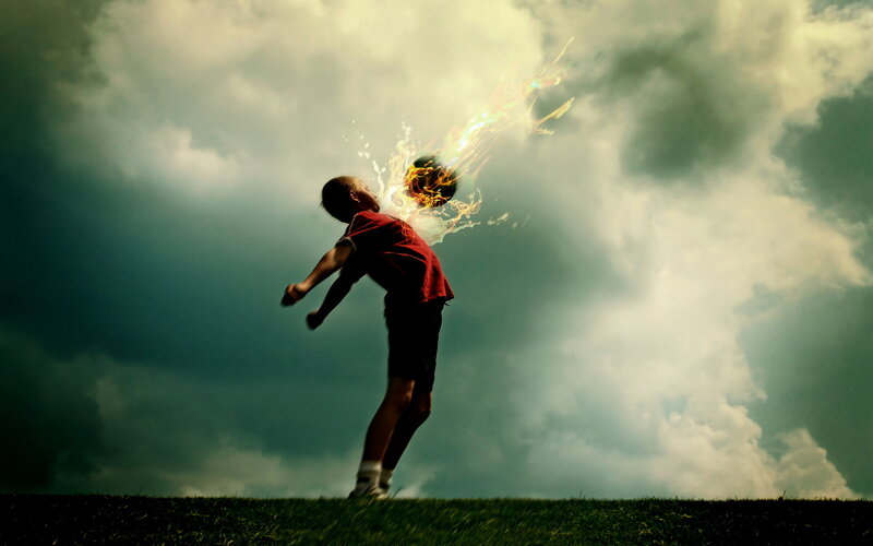 Child kicking flaming ball