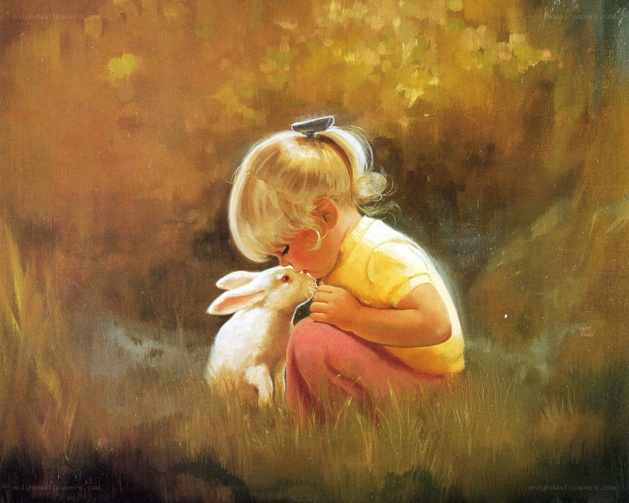 child kissing a rabbit