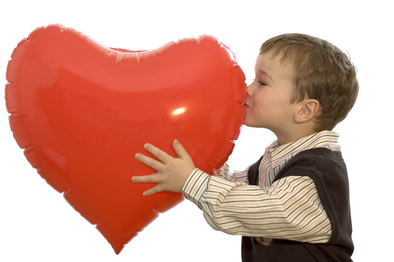 child kissing heart balloon