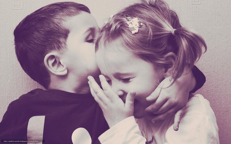 child kissing sister