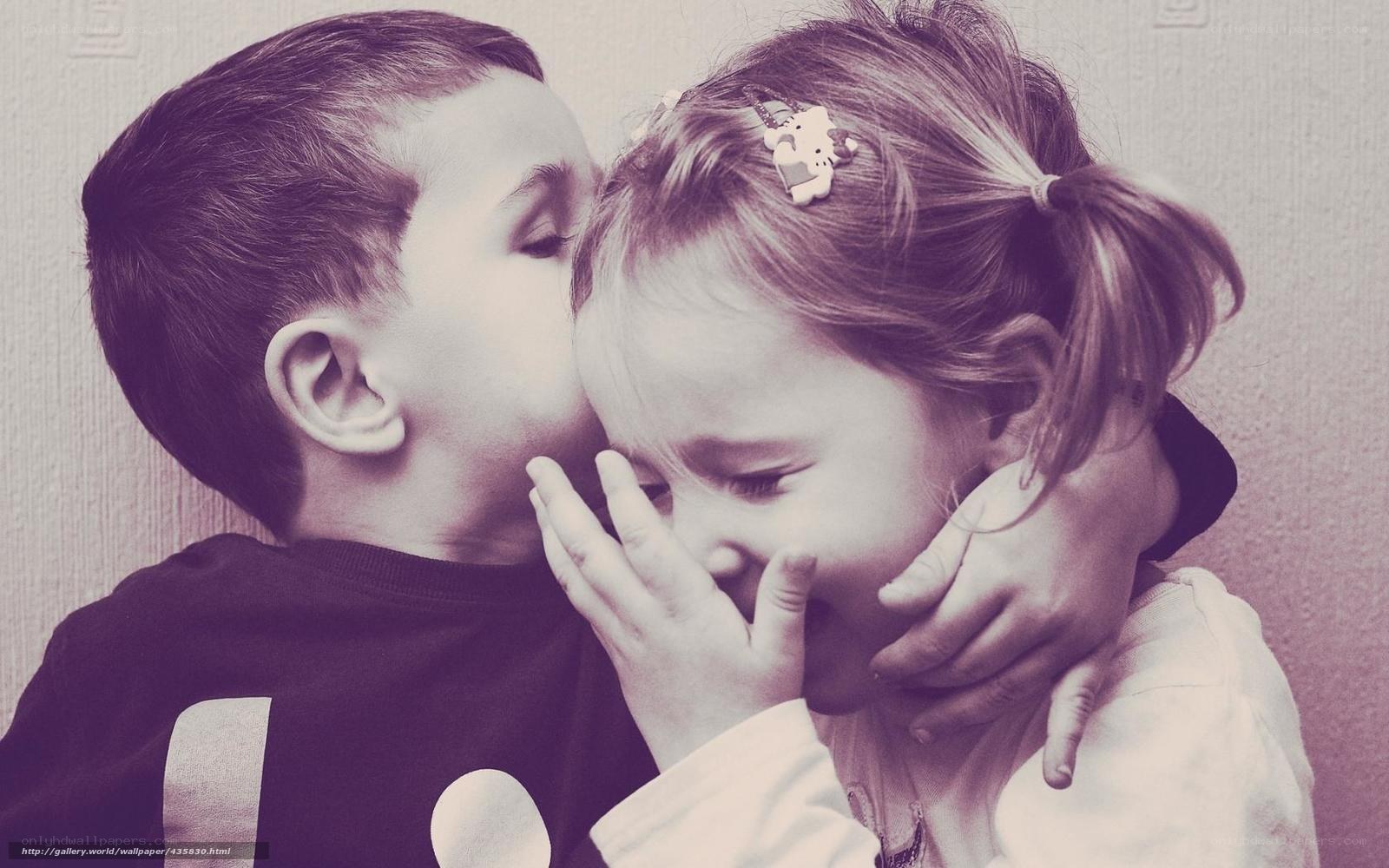 child kissing sister