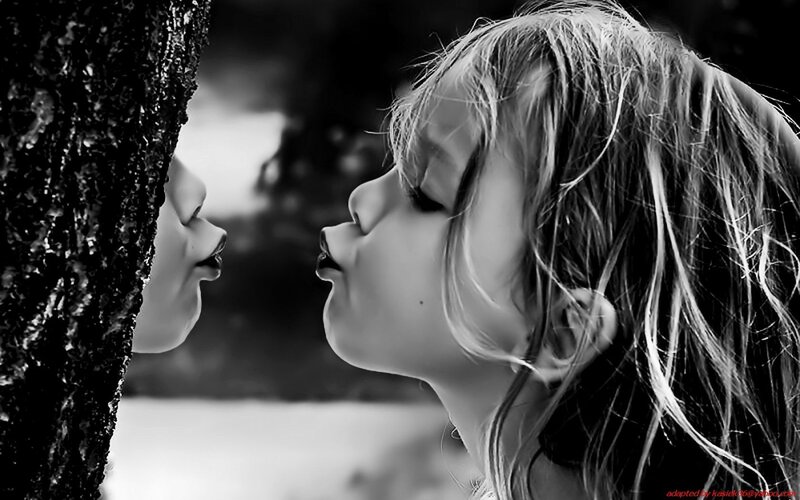 child kissing tree