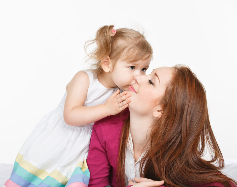 Child Kissing Woman