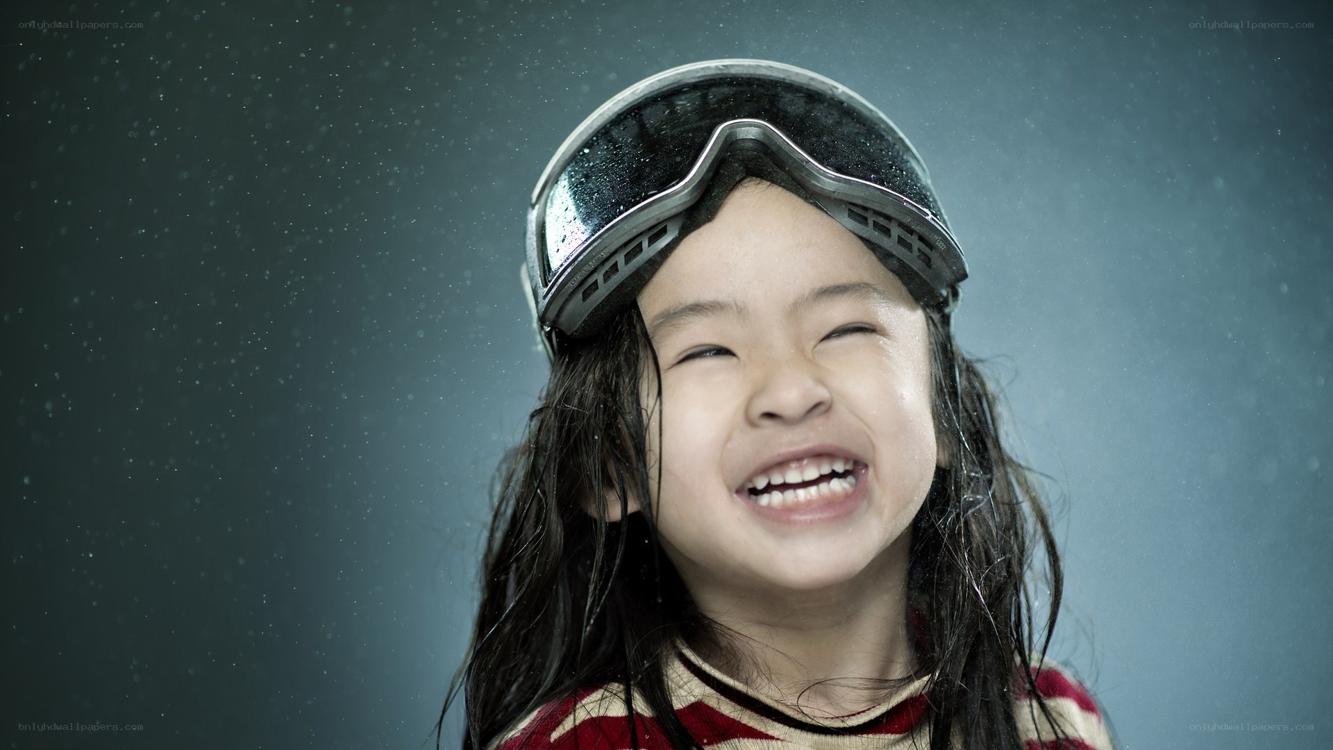 child laughing in snow