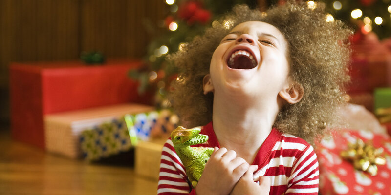 Child Laughing with Toy