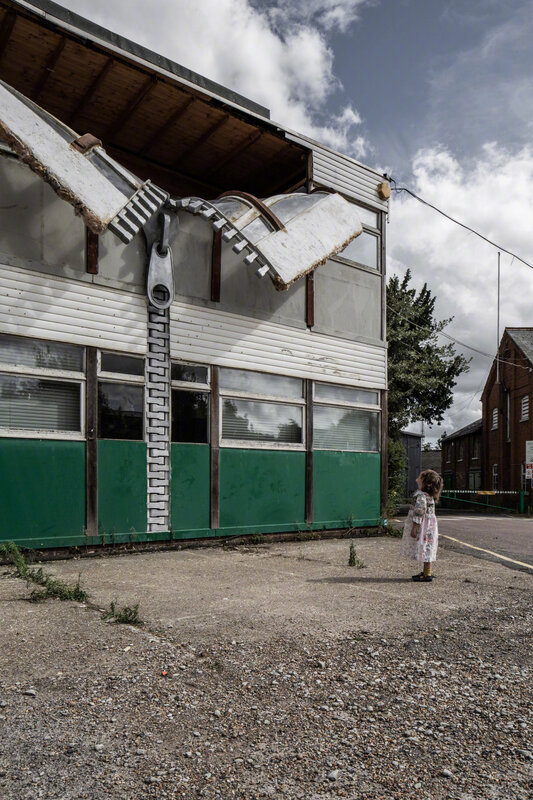 Child Looking at Building