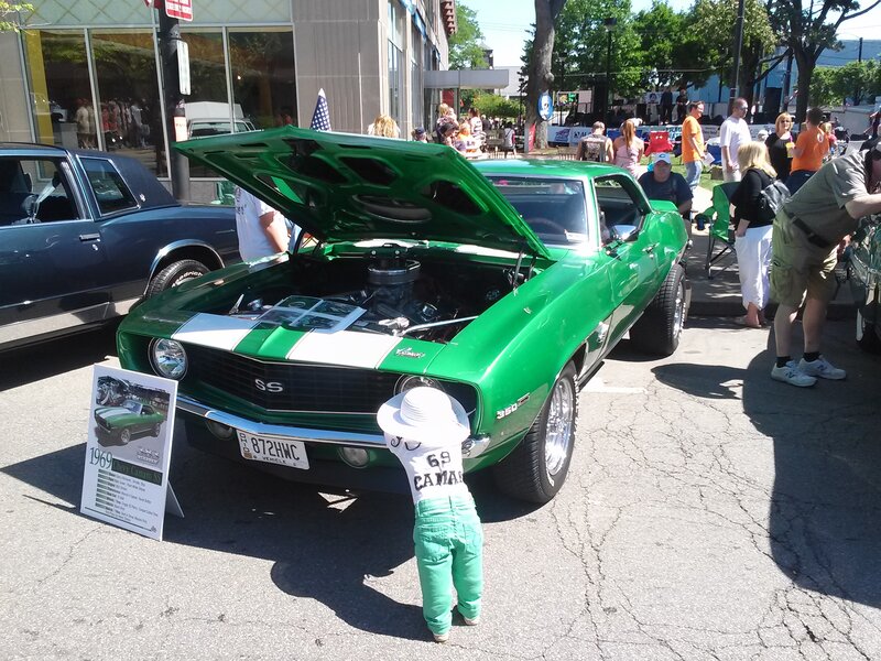 Child Looking at Car Engine
