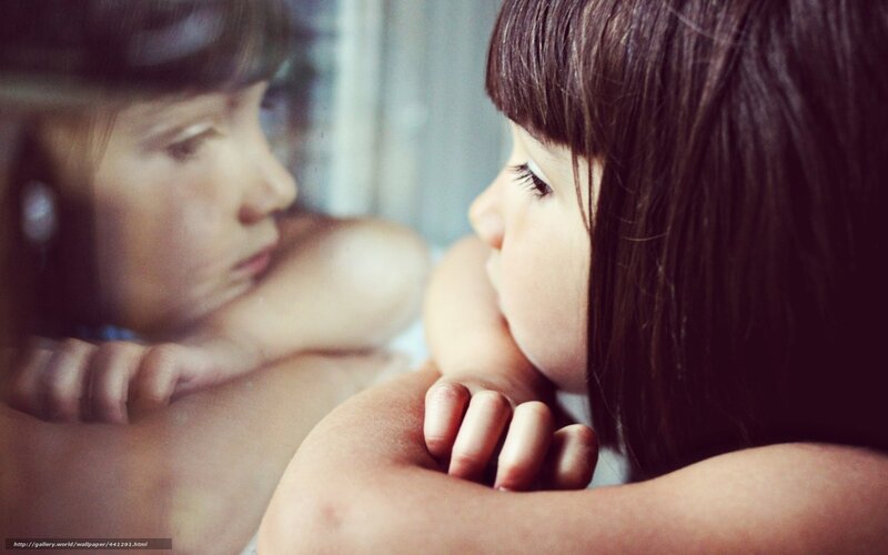 child looking at reflection