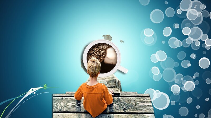 child looking into coffee cup