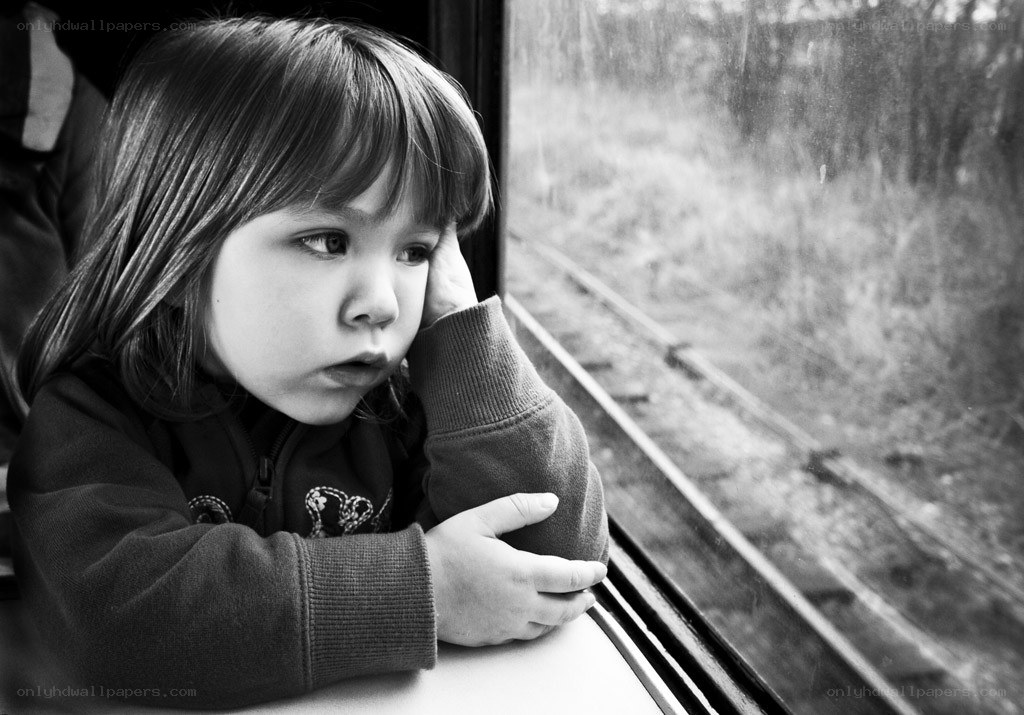 child looking out train window