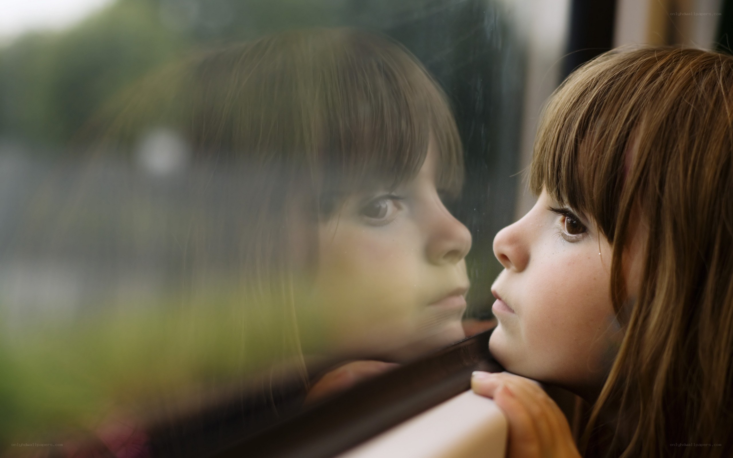 child looking out window