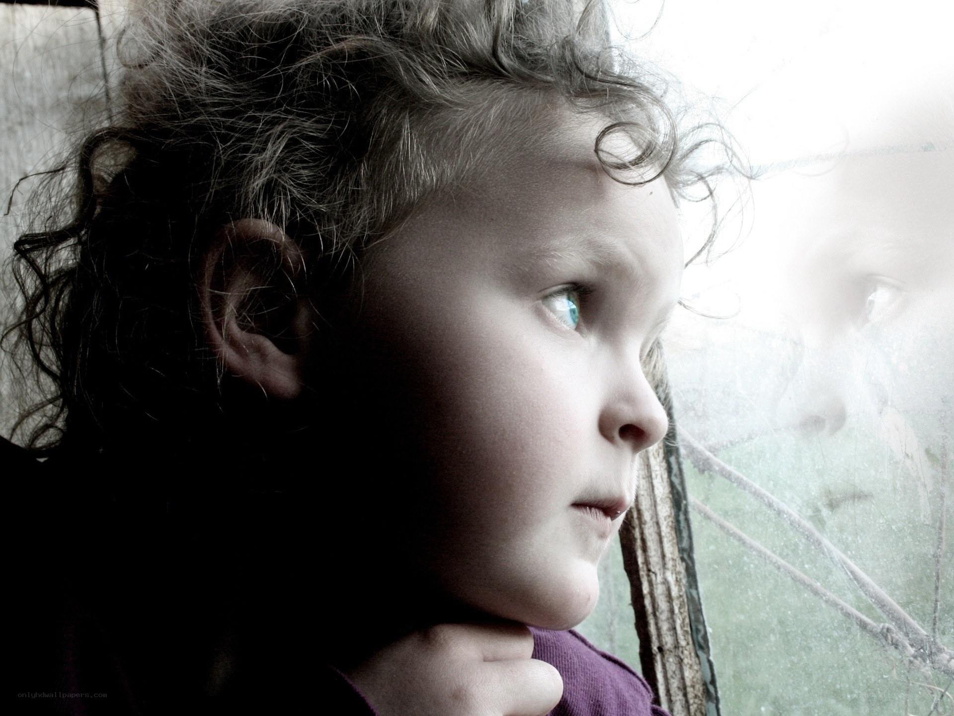 child looking out window