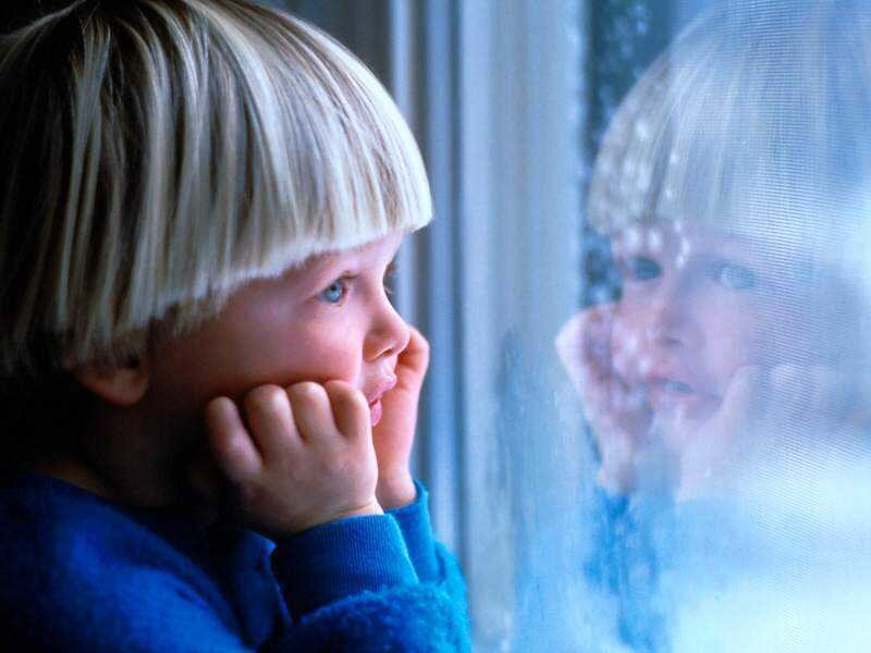 Child Looking Out Window — Blue