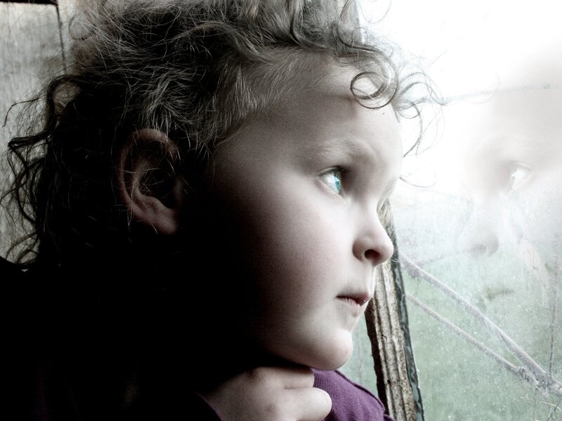 Child Looking Out Window — Gray