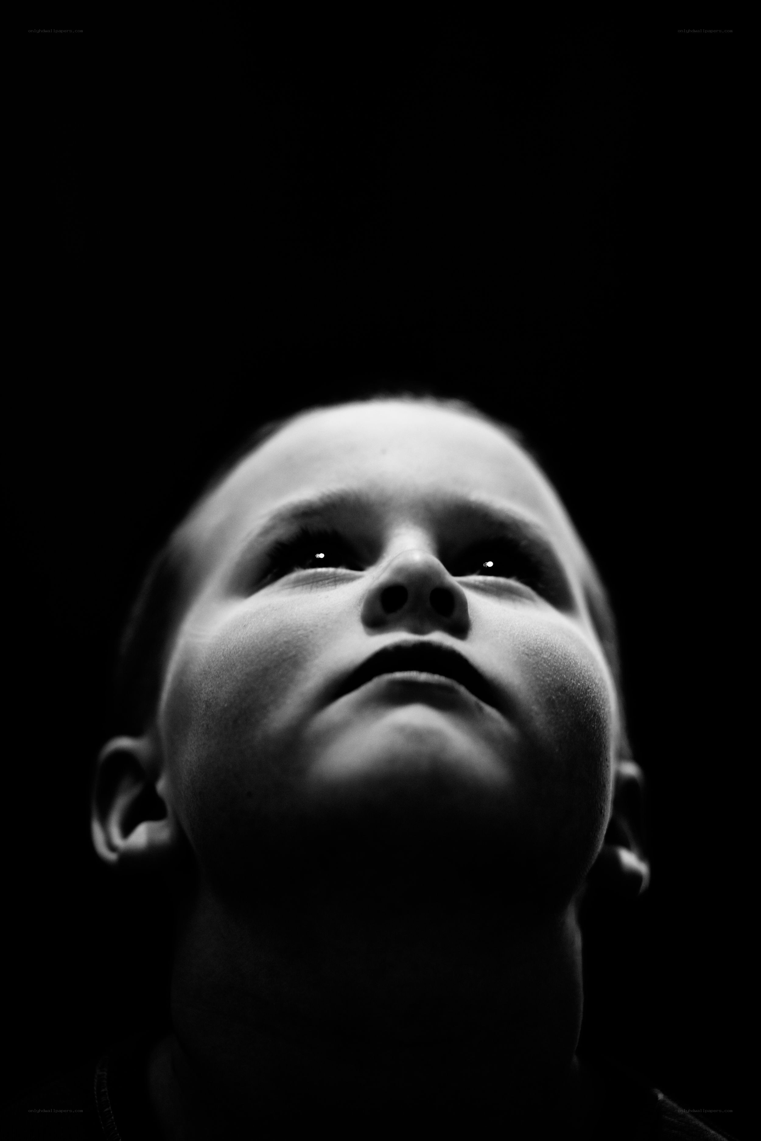 child looking up in darkness