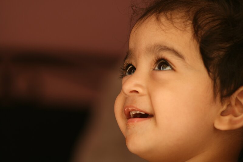 child looking up with smile
