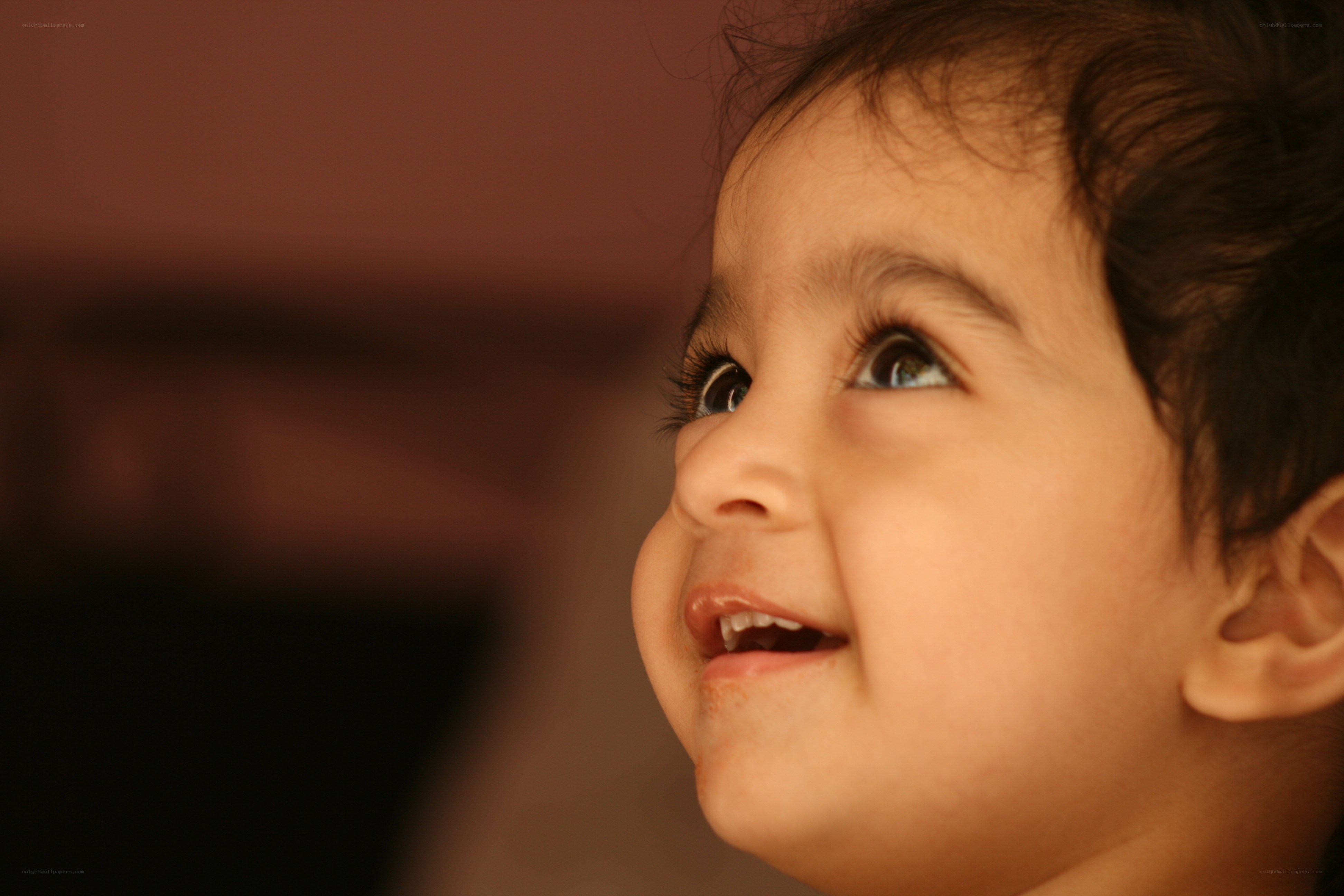 child looking up with smile