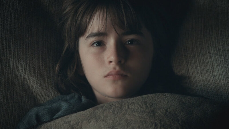 child lying in bed