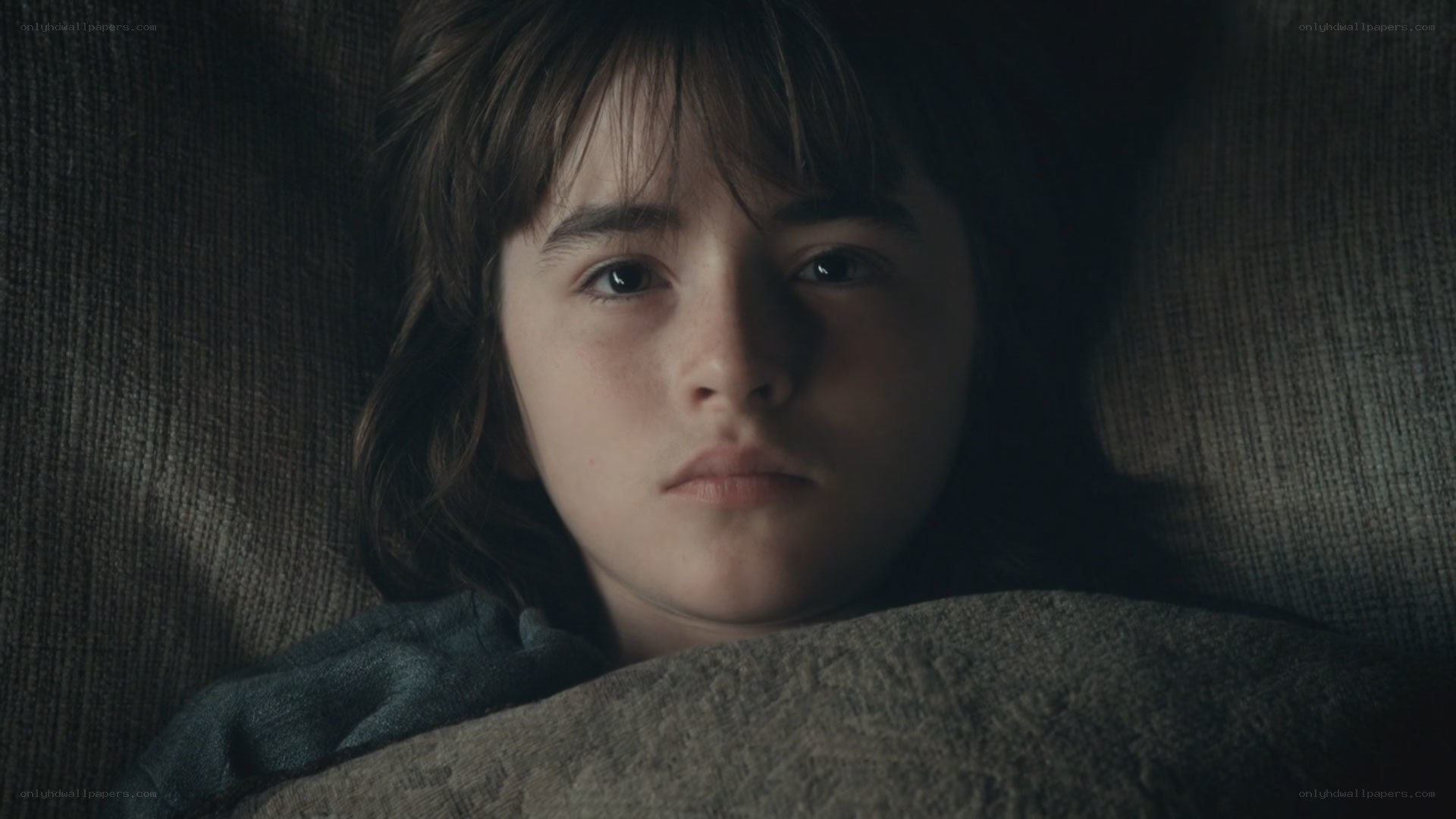 child lying in bed