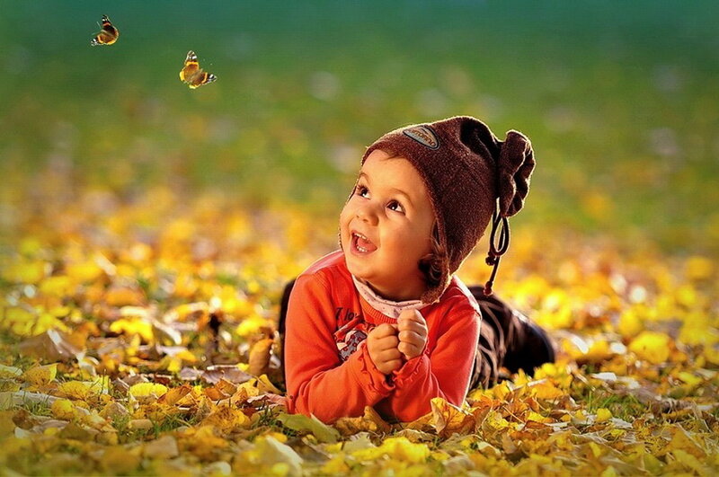 Child Lying in Leaves