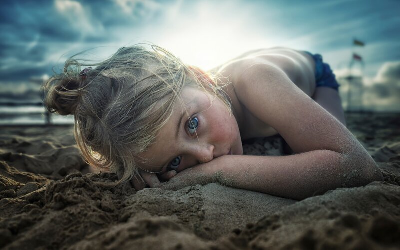 Child Lying on Beach