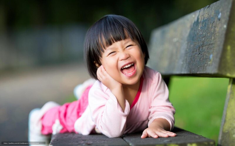Child Lying on Bench