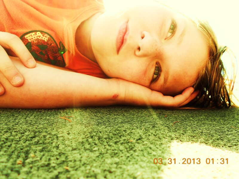 Child Lying on Grass — Green, Calm