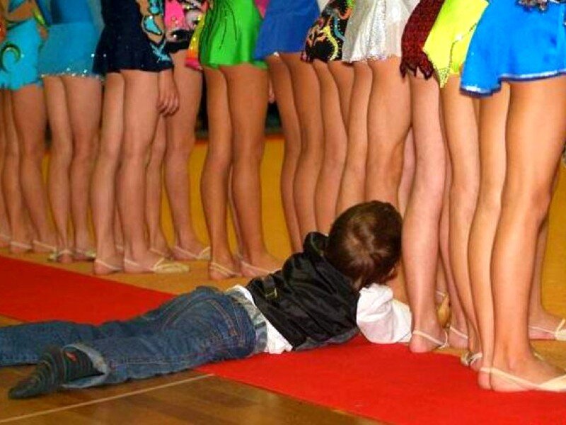 Child lying on red carpet
