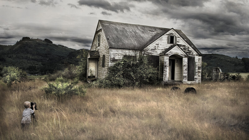 Child near abandoned house