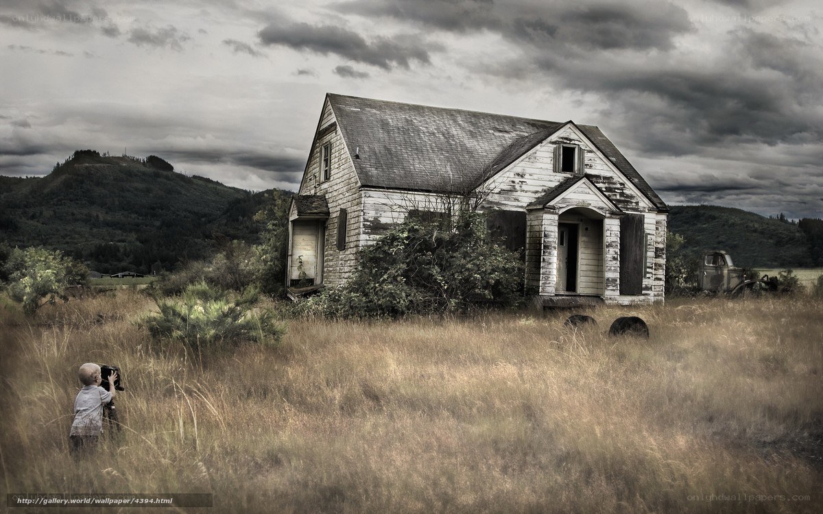 Child near old abandoned house