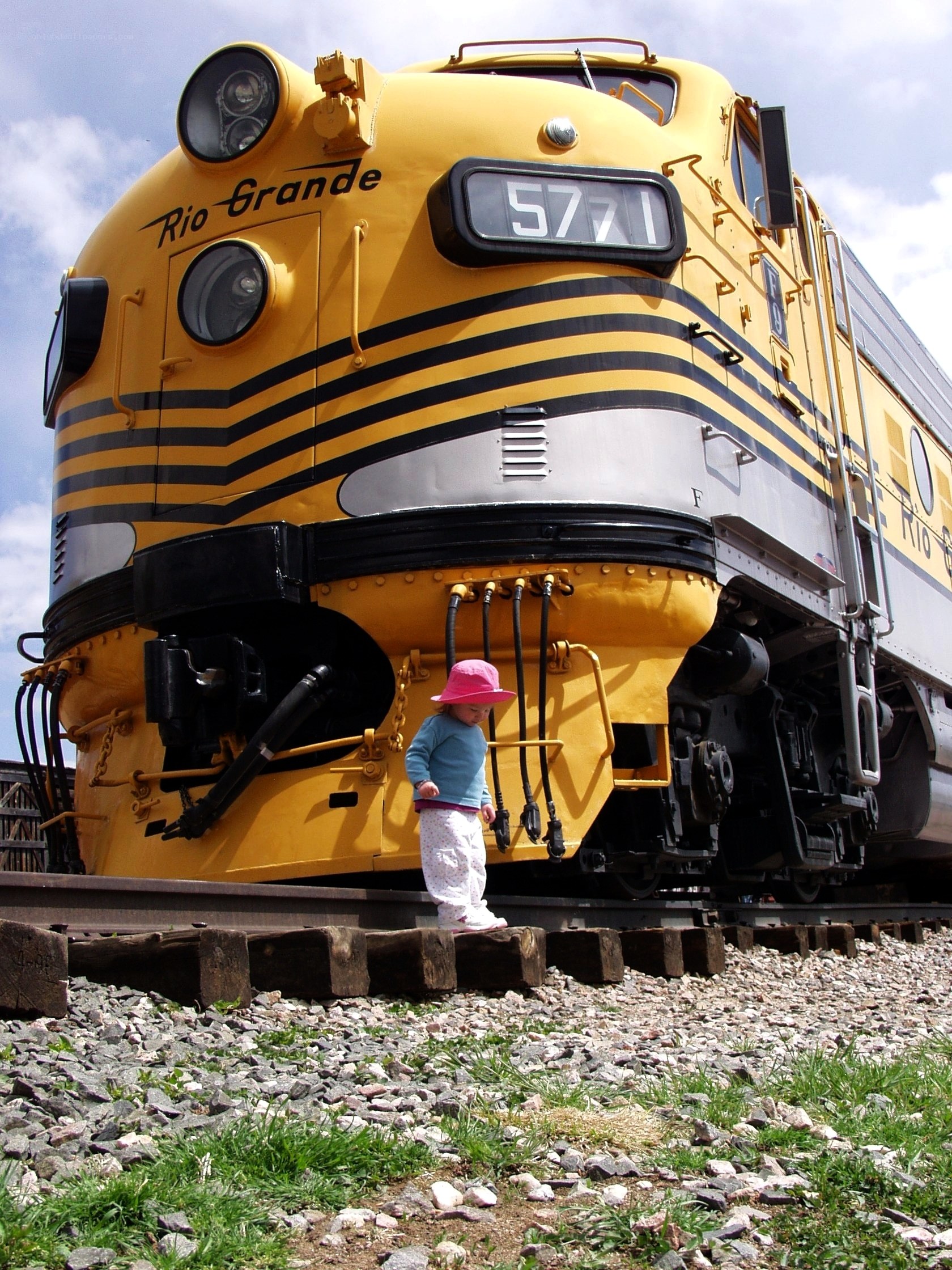 Child near yellow train