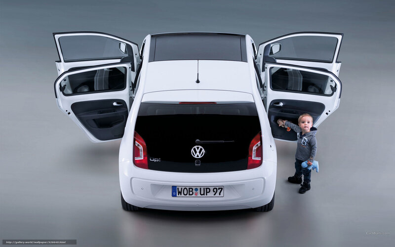child next to white car