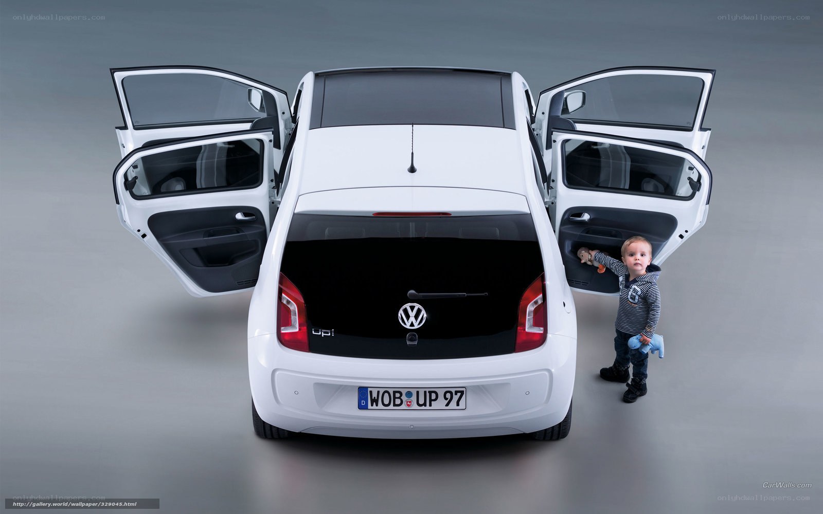child next to white car