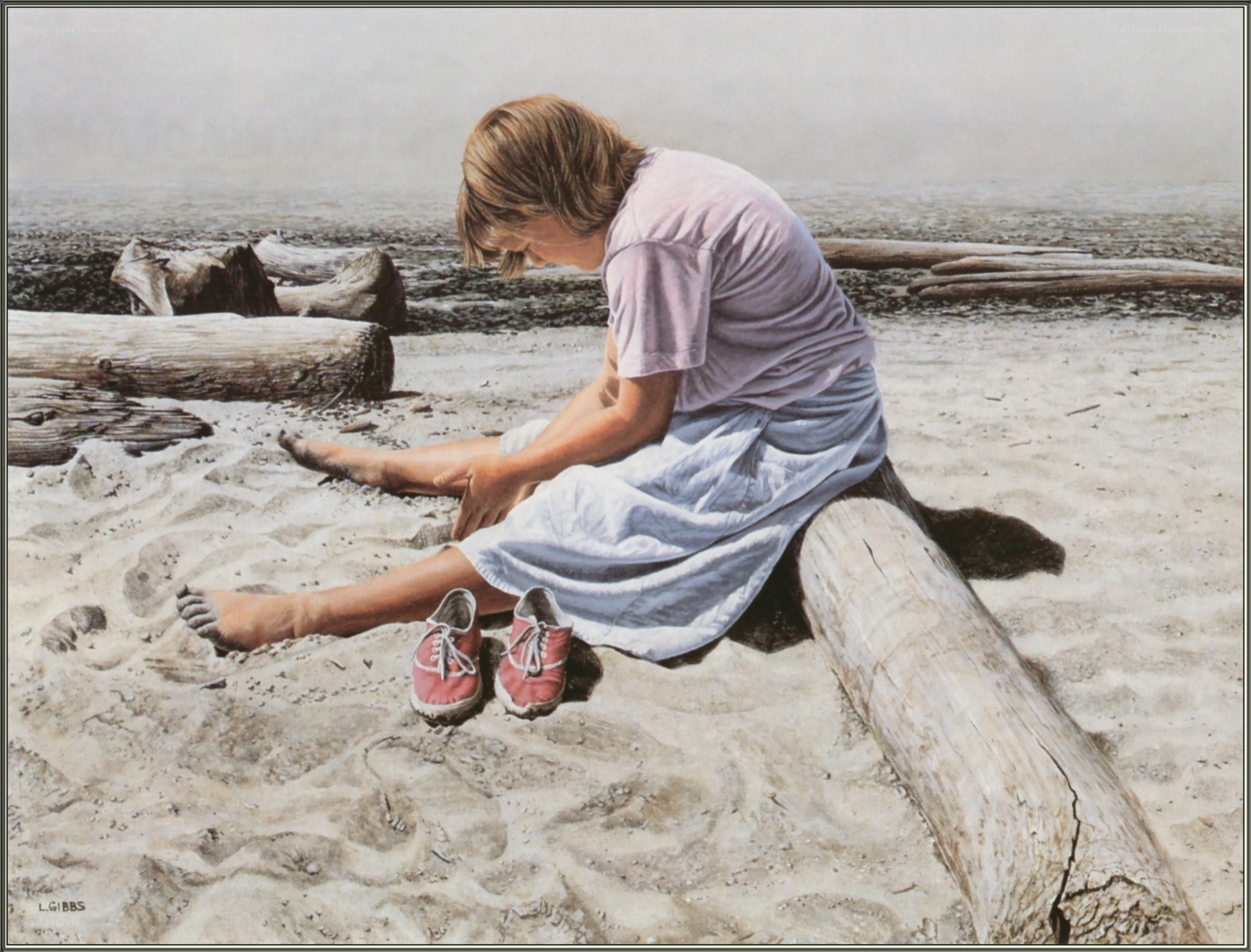 Child on a beach with red shoes