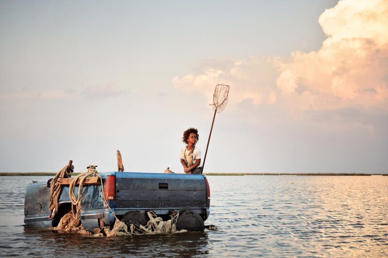 child on a boat in water
