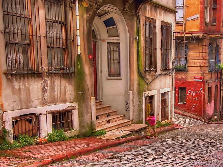 Child on a cobblestone street