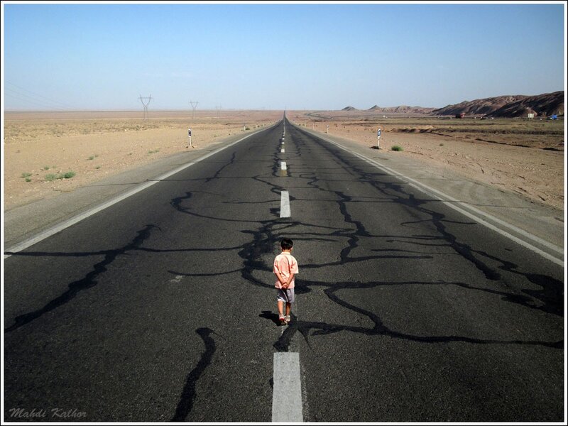 Child on a desert road