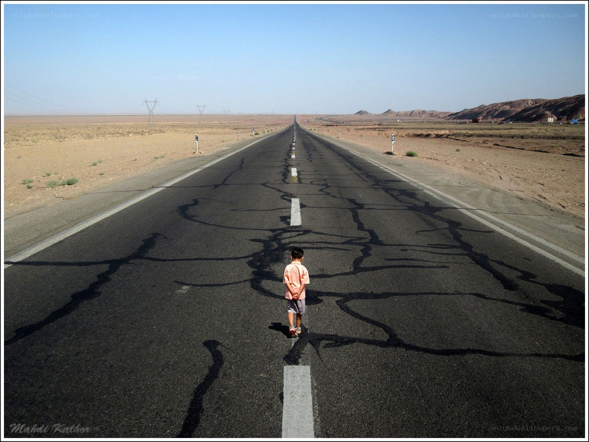 Child on a desert road