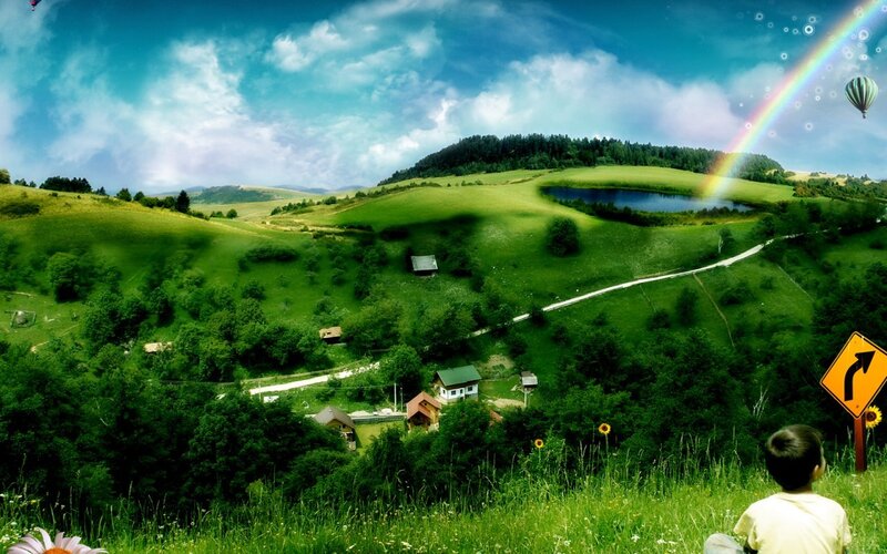 Child on a green hillside