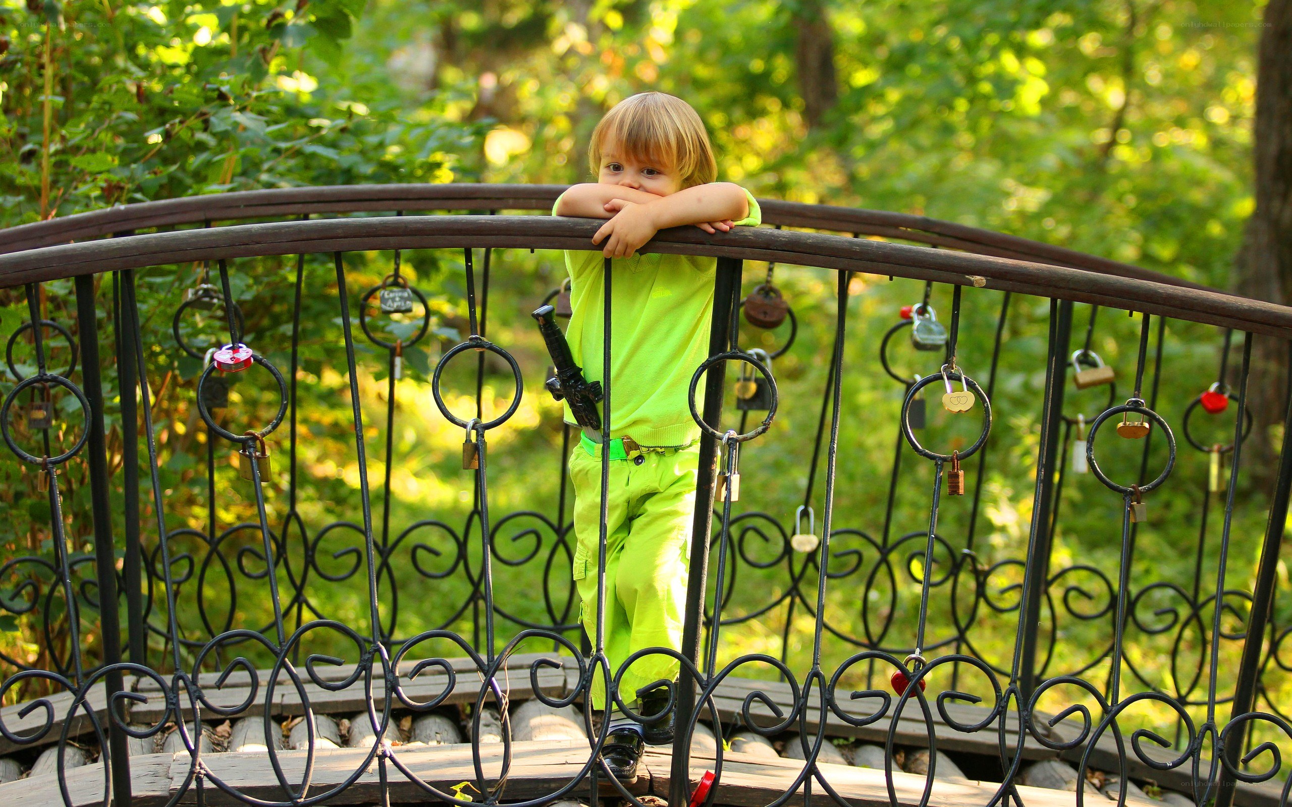 Child on a love lock bridge