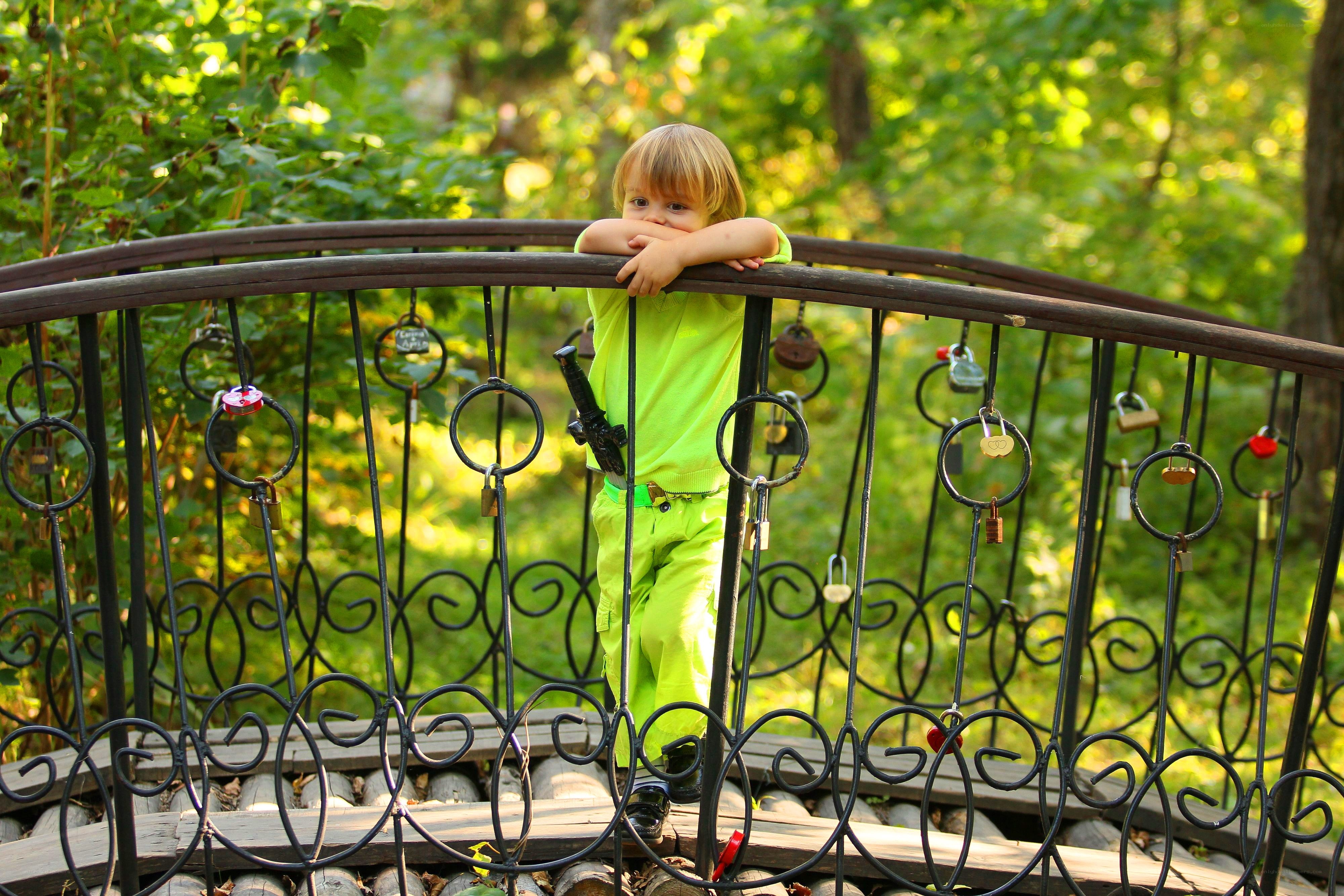 Child on a love lock bridge