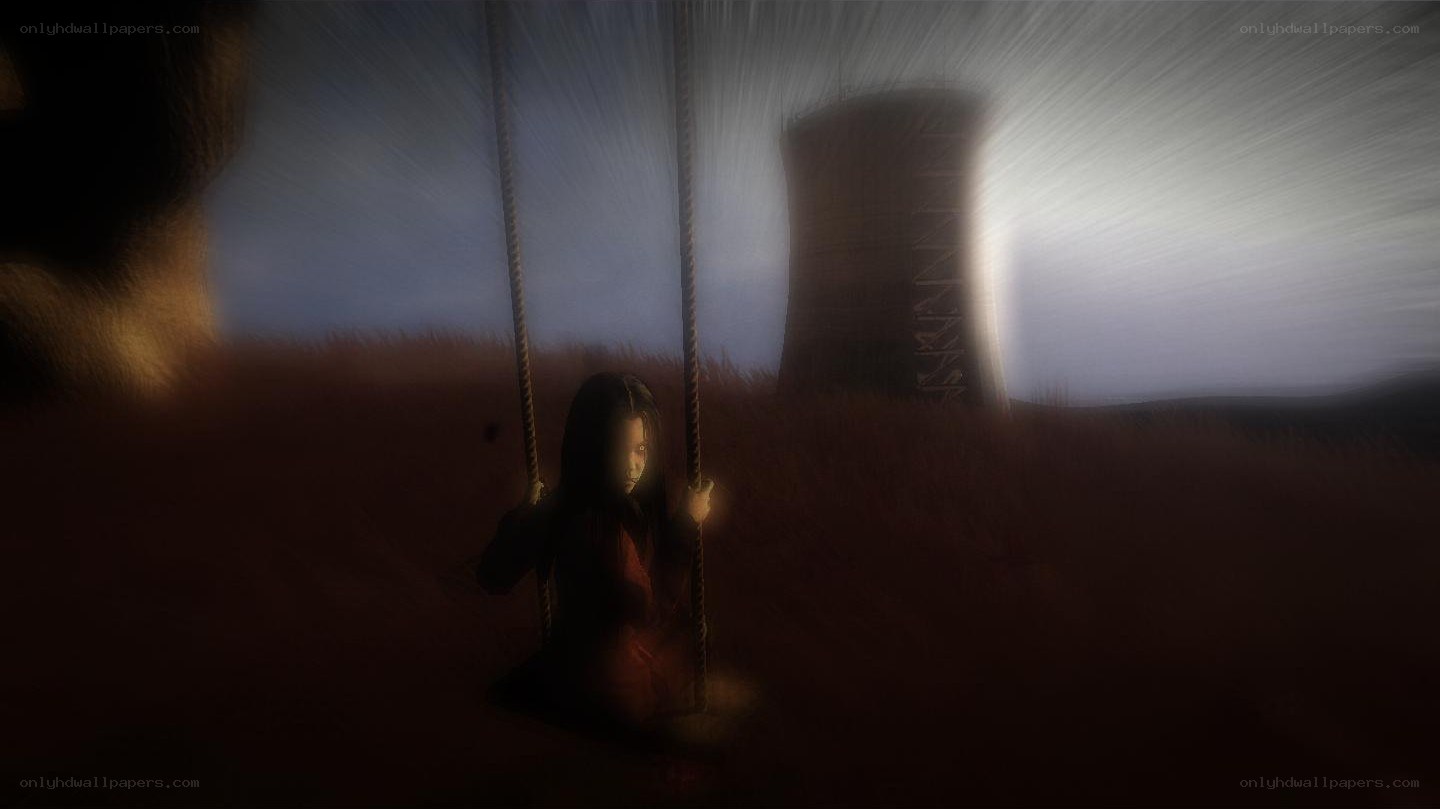 Child on a swing at dusk