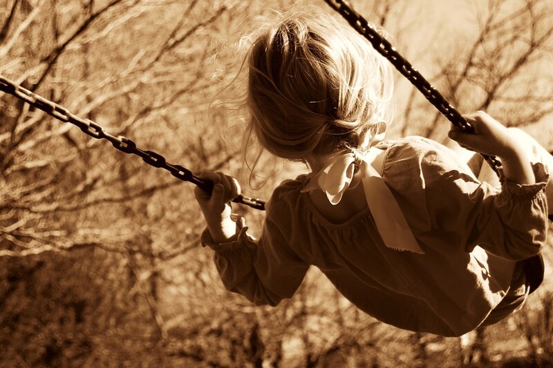 Child on a Swing — Sepia