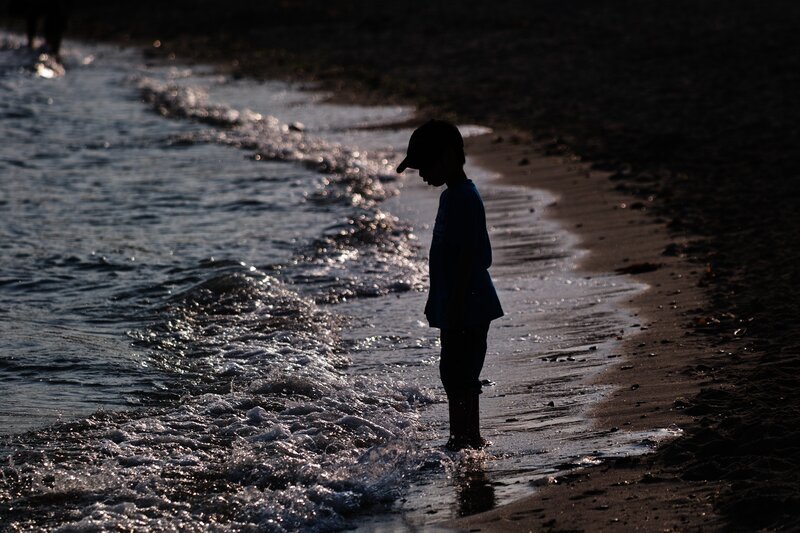 Child on Beach at Dusk — Black