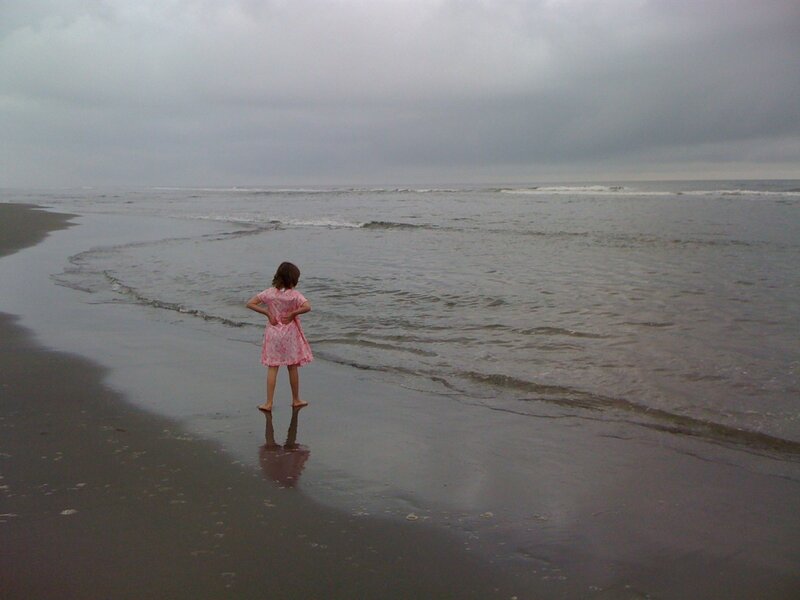 child on beach at low tide